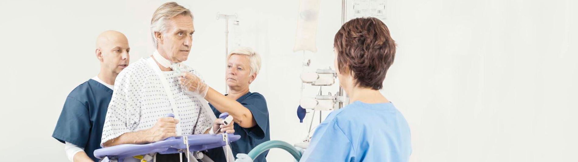 Arjo Early Mobilisation Sara Plus - Caregivers taking care of patient - 2135x600