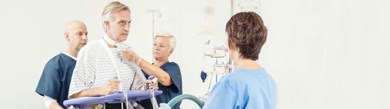 Arjo Early Mobilisation Sara Plus - Caregivers taking care of patient - 2135x600
