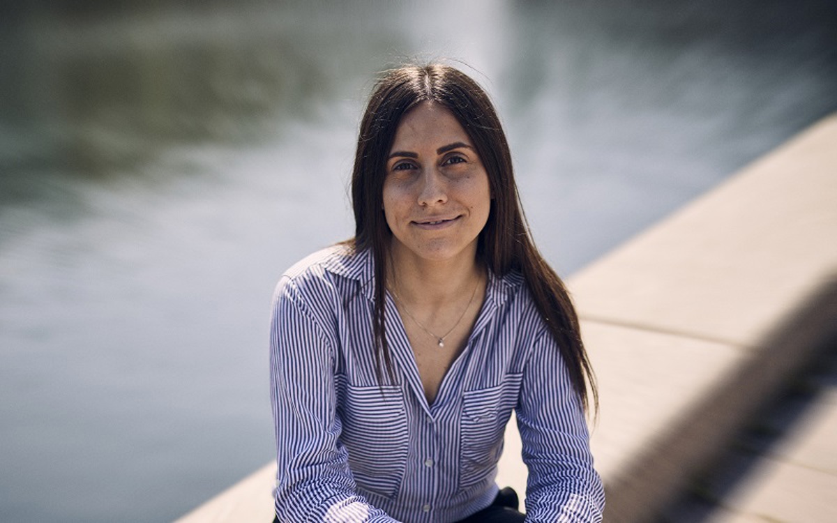 Arjo employee sitting by the water