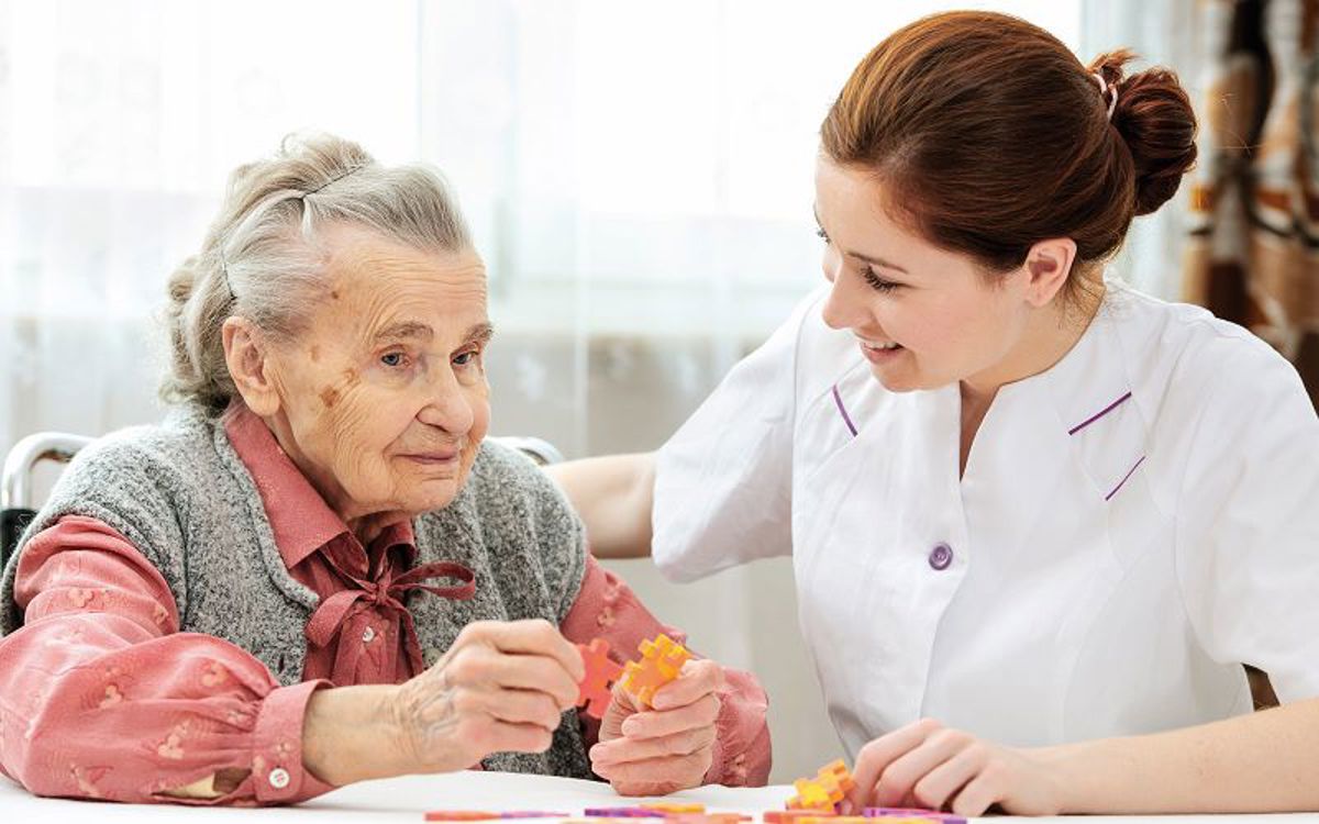 Arjo Insights Elderly Woman Nurse Low res.jpg