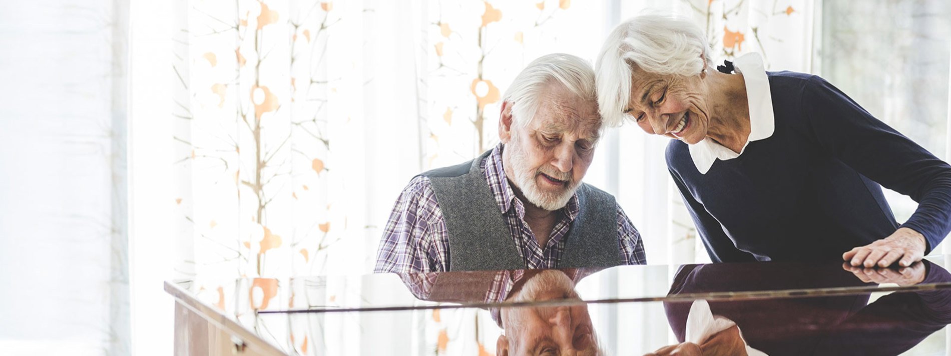 arjo.senior-couple-playing-piano.jpg